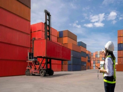 worker viewing containers